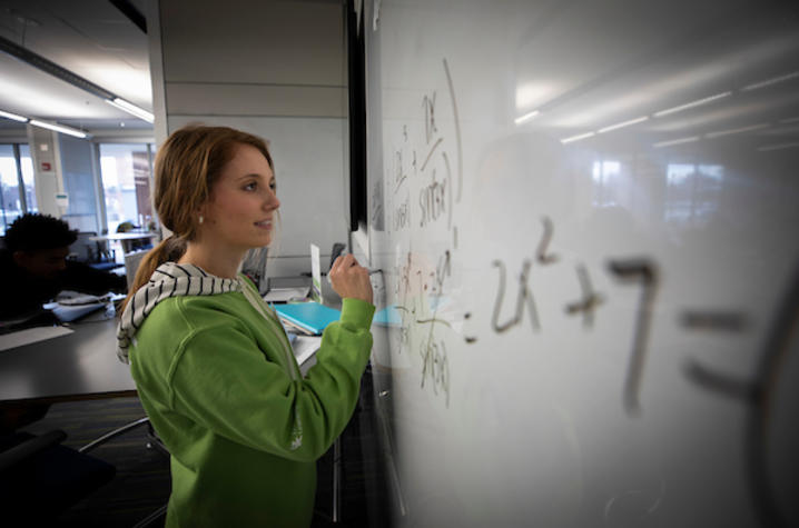 photo of person at a white board