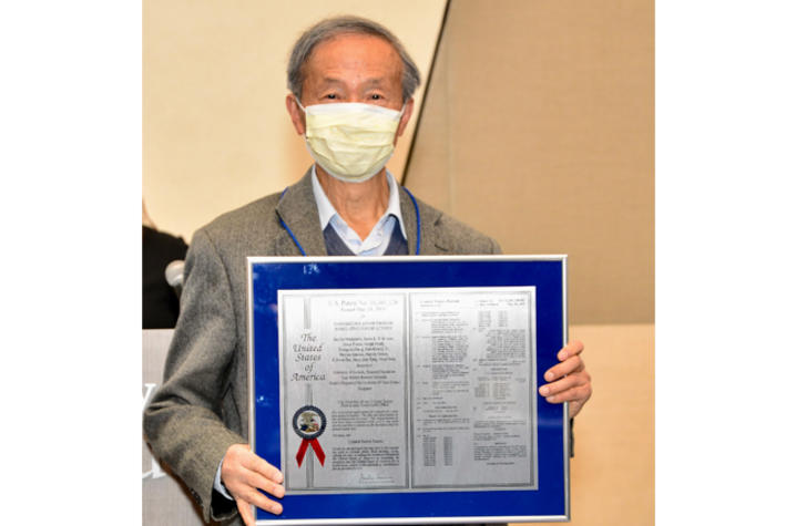 Hsin-Hsiung Tai received a milestone patent commemorating his tenth patent. Photo by Patrick Mitchell