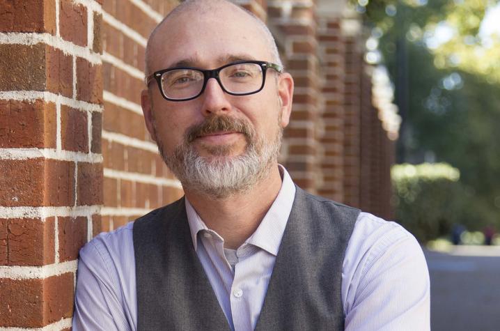 headshot photo of Eric Weig next to King Library