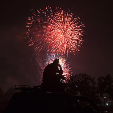 A person watching fireworks. 