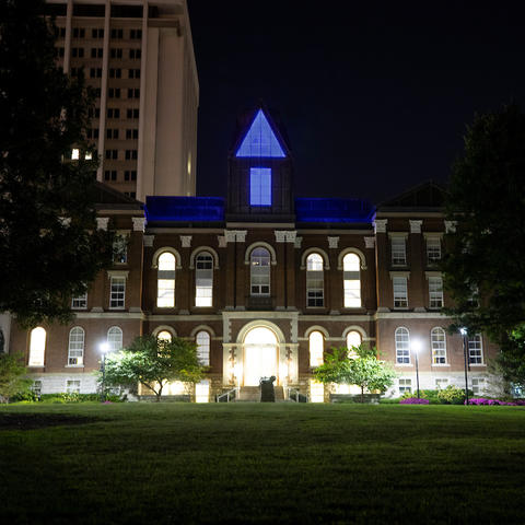 photo of Main Building lit in blue