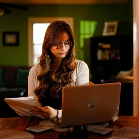 Photo of woman using a computer.