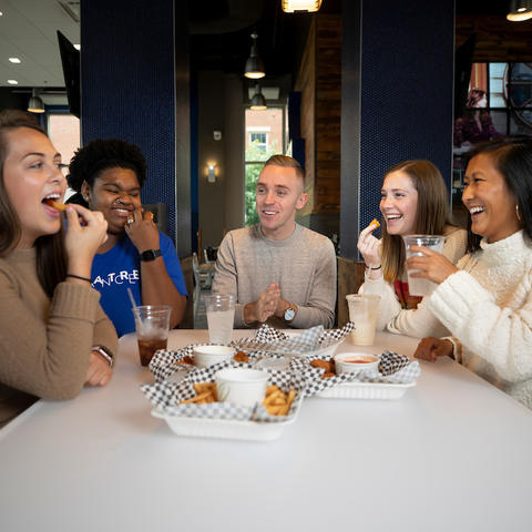 Photo of students eating together