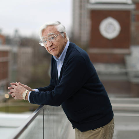 photo of Bob Lawson  taken on Law College landing with Memorial Hall and campus behind him