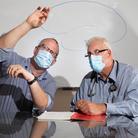 Gregory A. Jicha,  left, and Pete Nelson, of Sanders Brown Center on Aging on July 21, 2020. Photo by Mark Cornelison | UKphoto