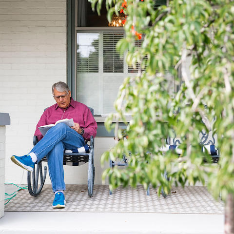 Tom Williams, a UKHC patient, enjoys a fall day on his front porch.