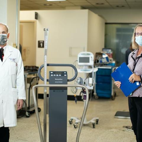 Dr. Richard Greenberg and Linda Rice, director of Clinical Operations for the UK Center for Clinical and Translational Science, stand socially distanced in the UK Vaccine Trial Clinic. 