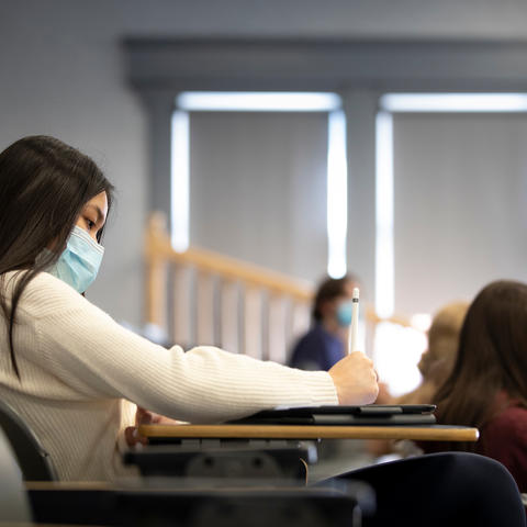 Photo of student studying in class with mask on