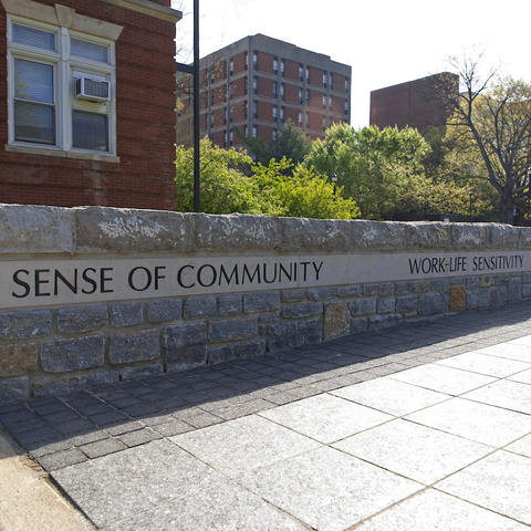 Wall in plaza in front of Memorial Hall with "A Sense of Community" etched into it
