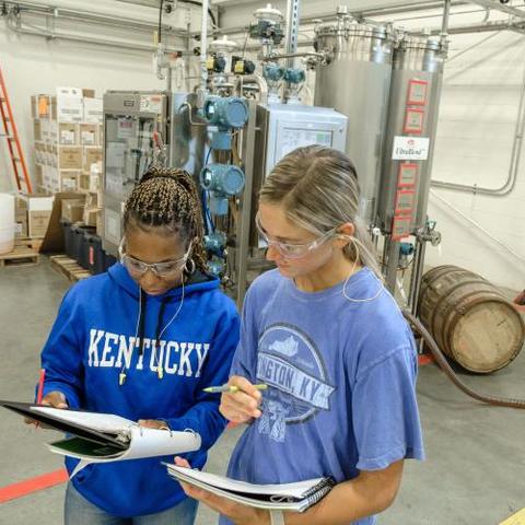 UK Distillation, Wine and Brewing Studies students Johnna Campbell and Riley Neill study their notes on the UltraBlend™ system. Photo by Matt Barton