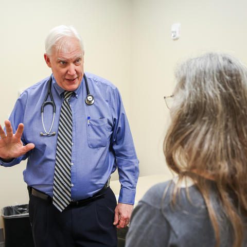 Greg Jicha, M.D., Ph.D., director of clinical trials at UK’s Sanders-Brown Center on Aging, conducts an exam. Mark Cornelison | UK Photo