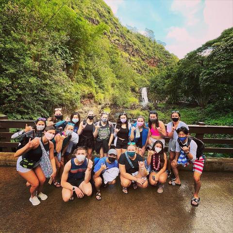 Group of students in front of local waterfall
