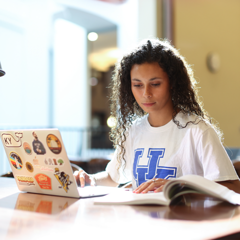 Student studying inside William T. Young Library