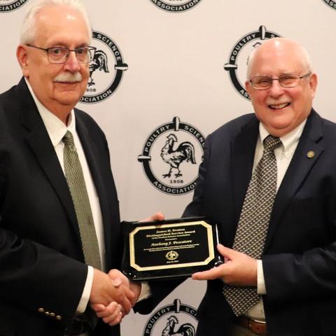 Anthony “Tony” Pescatore receiving award