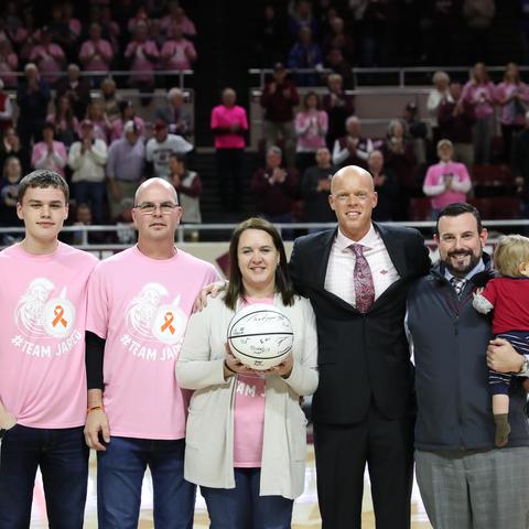 image of Chitwood family with Coach Hamilton at EKU basketball game