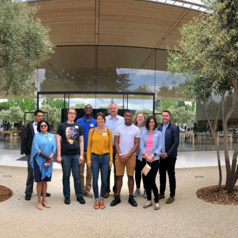 Students and staff standing in front of Apple's Enterprise Design Lab. 