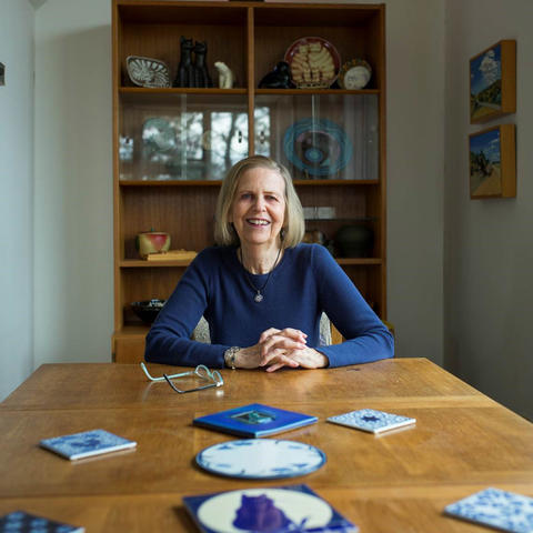 photo of Bobbie Ann Mason seated at end of dining table