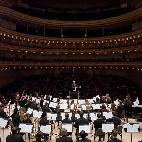 photo of Cody Birdwell conducting the UK Wind Symphony at Carnegie Hall in 2019