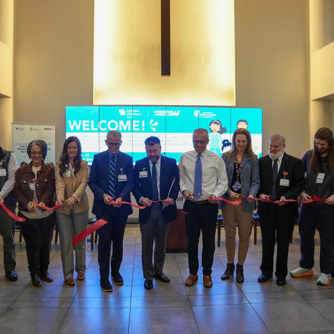 Image of hospital administrators cutting a ribbon