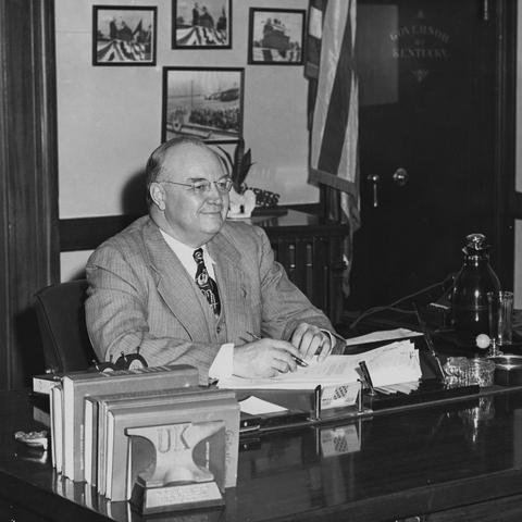 photo of Governor Earle C. Clements at desk