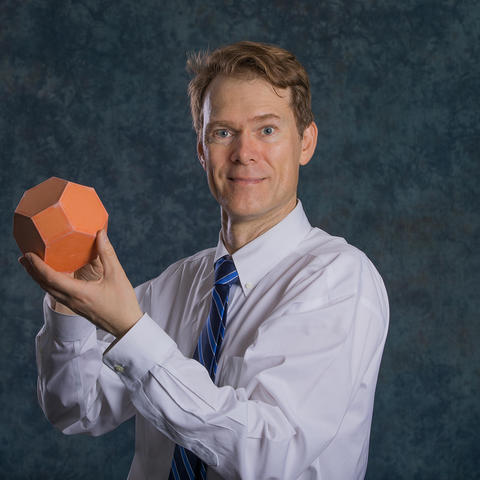 photo of Richard Ehrenborg with a polyhedron