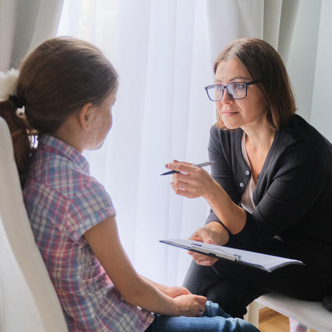 Photo of woman counseling young girl