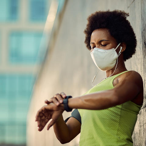 photo of woman wearing smart watch
