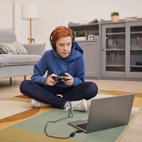 kid gaming on laptop