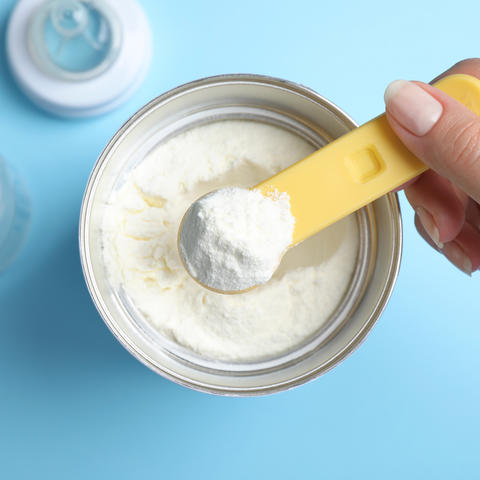 Image of a scoop of powdered baby formula