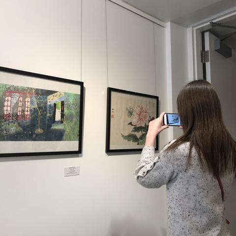 photo of visitor taking picture of “In My View” art