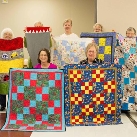 The Bluegrass chapter of Quilts for Kids present some of the quilts they have made