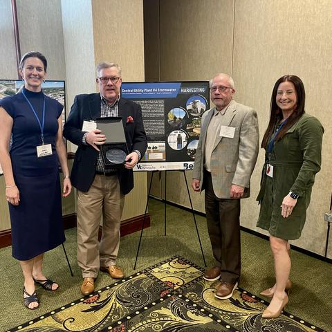Graham Gray (second from left), executive director of Utilities and Energy Management, along with Cara Boggess, Bob Pickerill and Megan Hogan with Bell Engineering accepted the award. 