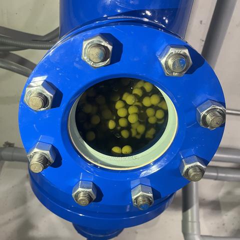 The innovative new cleaning system recently installed on two campus chillers operates by automatically injecting small rubber balls into the condenser water flow every 20 minutes.