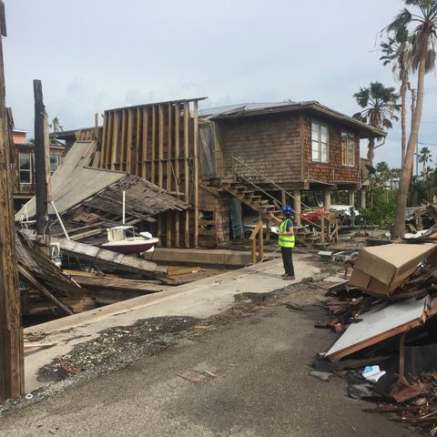Photo of Mariantonieta Gutierrez Soto surveying damage