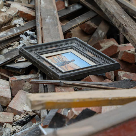 Painting lying on top of a pile of debris after a tornado in Western Kentucky
