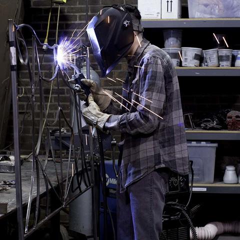 photo of student in Fine Arts Institute metalworking class