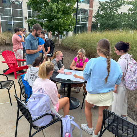 Honors students planning pollinator garden