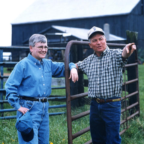 Photo of Deborah Reed in field with farmer