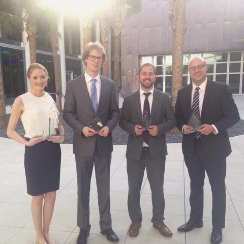 Four CASE competition participants standing outside at the event.