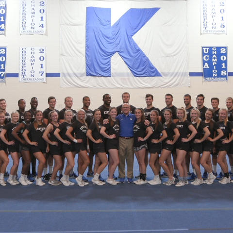 This is a photo of the UK Cheerleading Squad, with T. Lynn Williamson in the middle.
