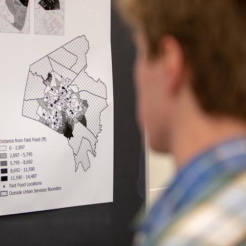 Student looking at a map