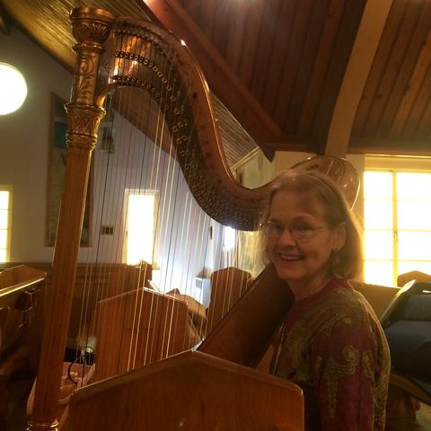 photo of Elaine Cook with Thomas Harlan's Lyon & Healy harp