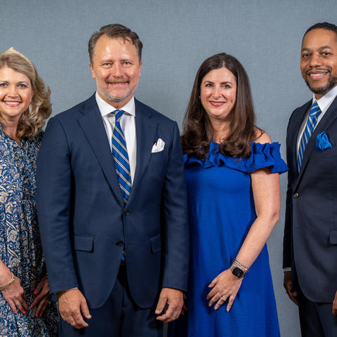 The 2025-26 UK Alumni Association officers are, from left, Jill H. Smith, secretary; Thomas K. Mathews, president; Kelly Sullivan Holland, president-elect; and Quentin R. Tyler, treasurer. Photo by Scott Hayes.