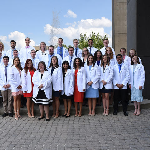 35 students in white coats