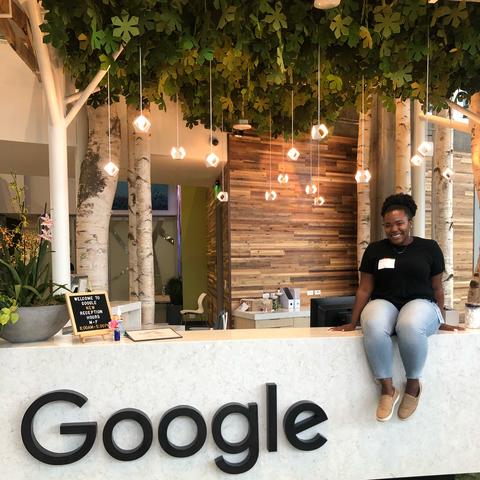 Kymberley Johnson poses by a Google logo