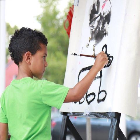 photo of child painting at Global Confucius Institute Day