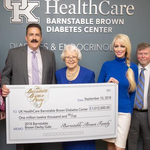 2018 check presentation to UK HealthCare's Barnstable Brown Diabetes Center. Left to Right – Dr. Lisa Tannock, Dr. Mark F. Newman, Willie Barnstable, Tricia Barnstable-Brown, Dr. John Fowlkes