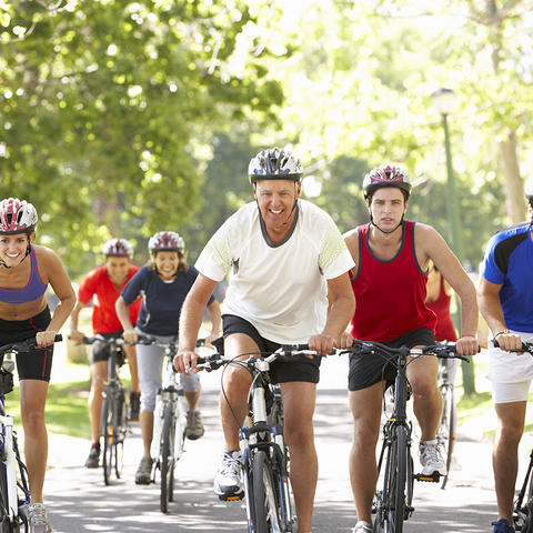 A group of people riding bikes.