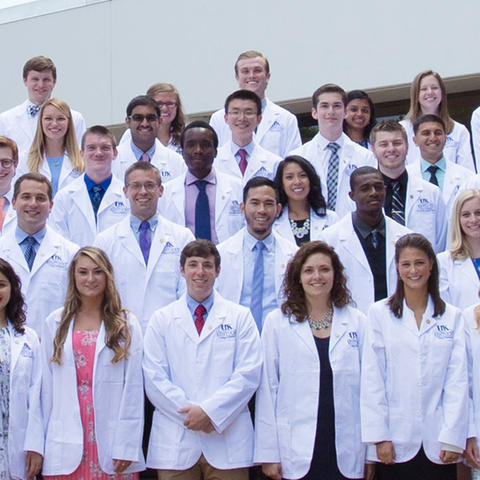 Group of medical students in white coats