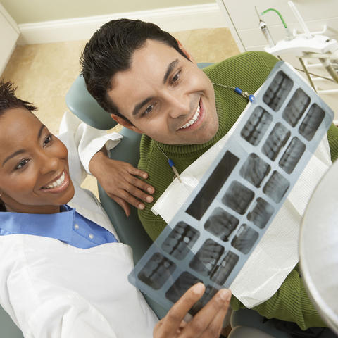 photo of dentist and patient
